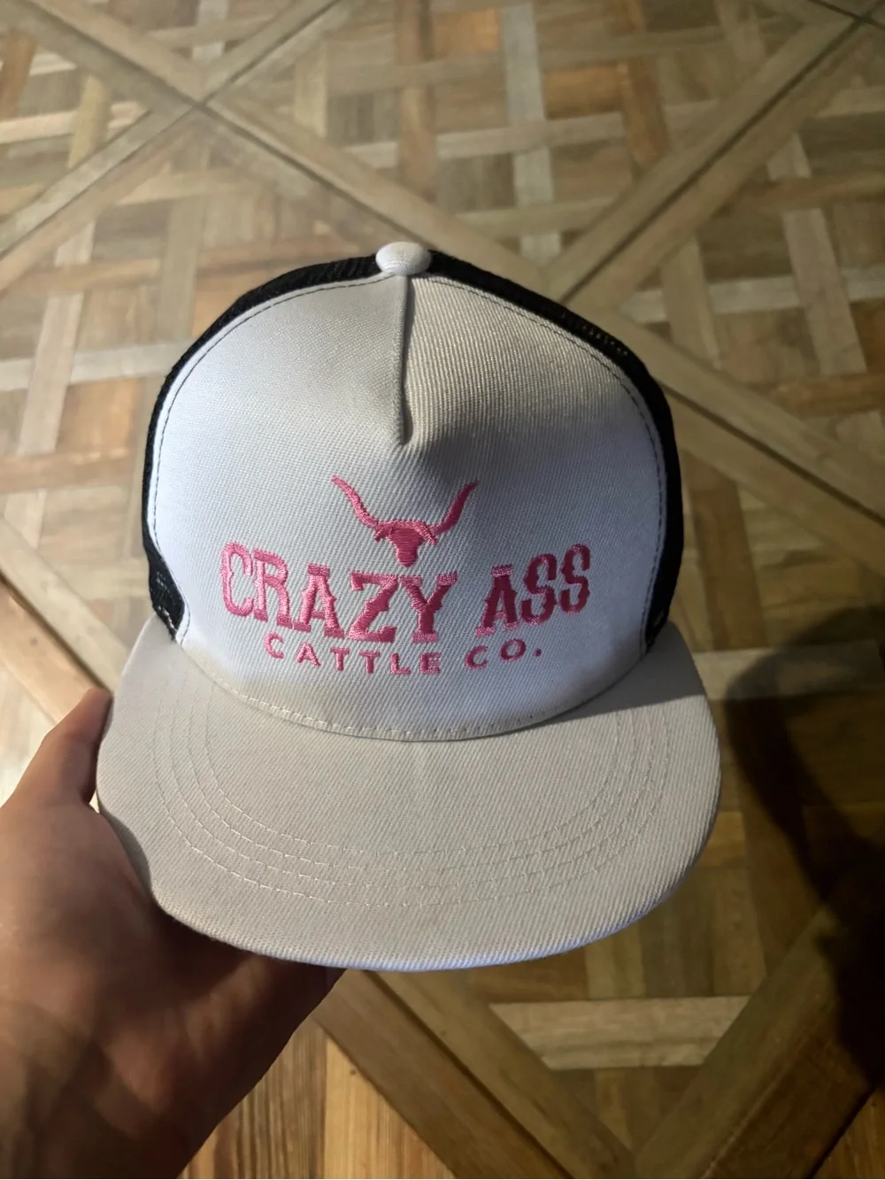Crazy Ass Cattle Co. white & black hat with pink logo